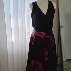 Elegant Black Top and Red Floral Skirt Outfit.